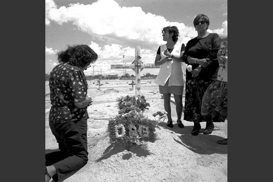 A family at a gravesite.
