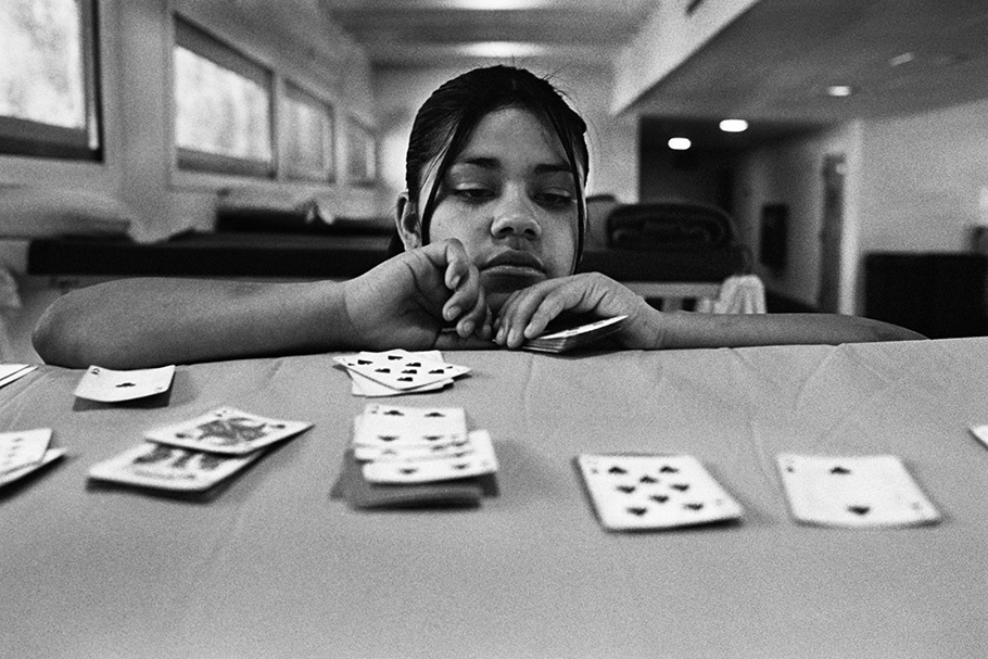 A girl playing cards. 