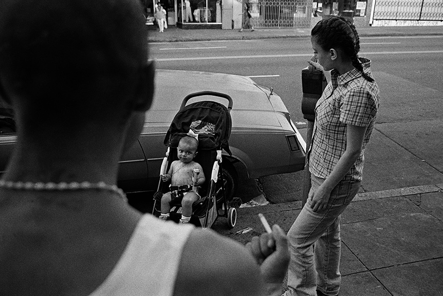 Parents and a child in a stroller. 