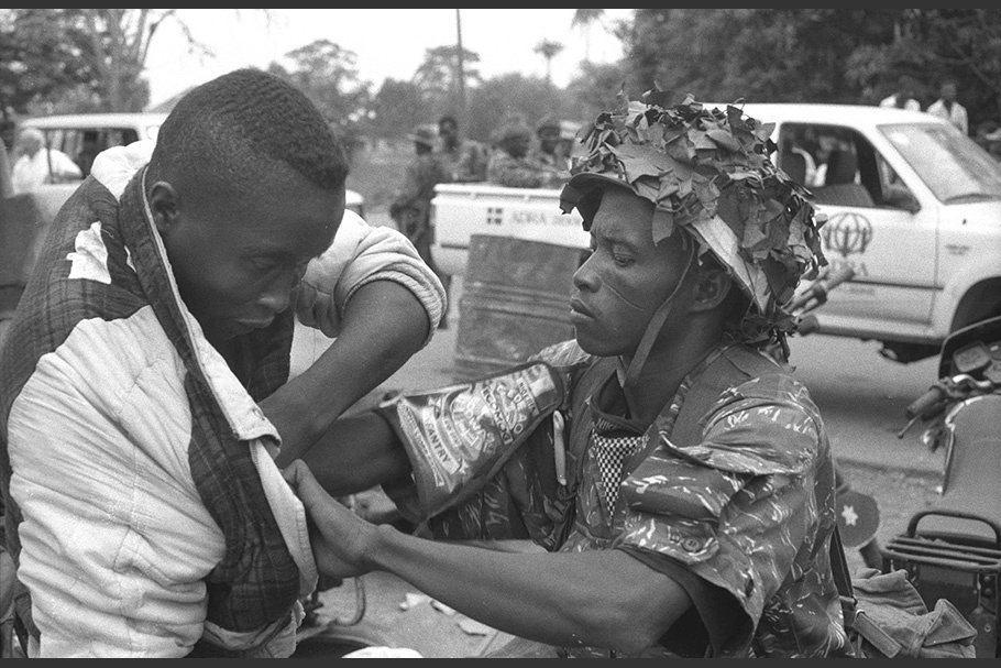 A soldier searches a man.
