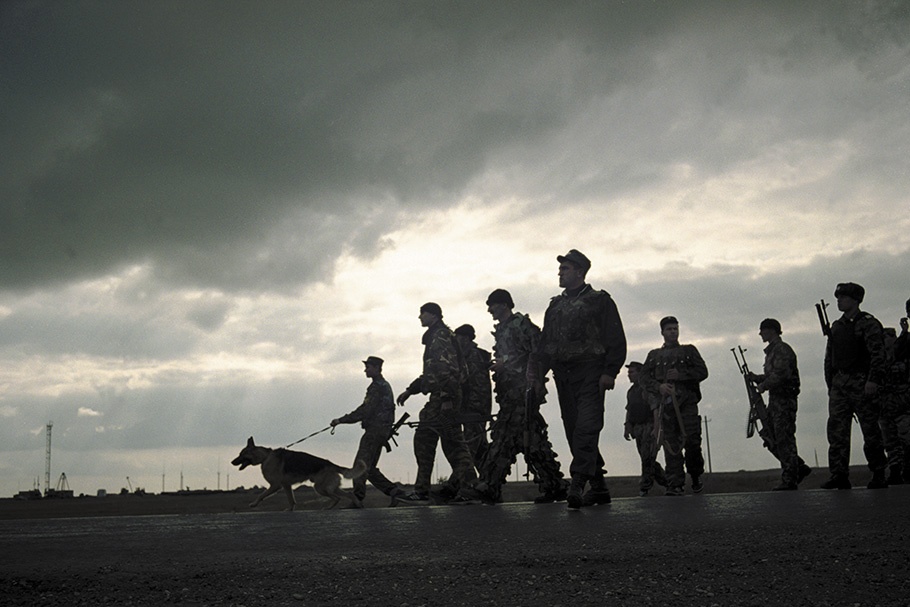 Soldiers with a dog.