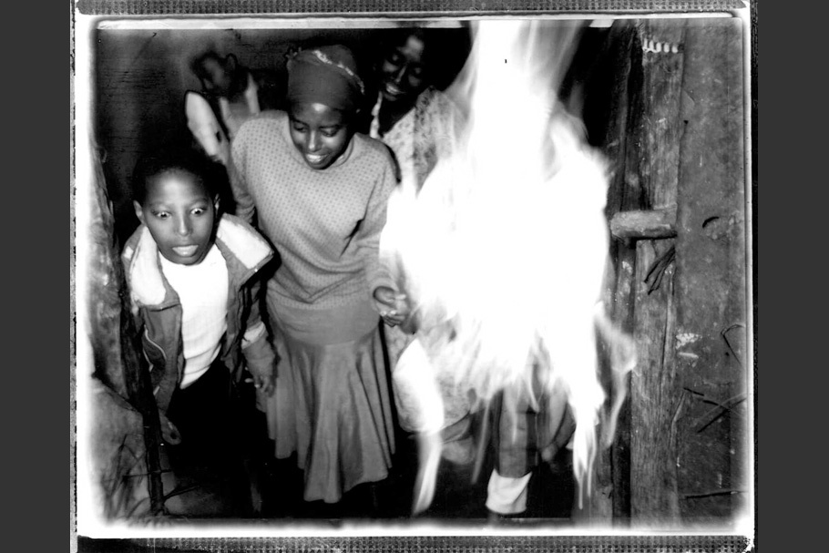 Children next to a fire.