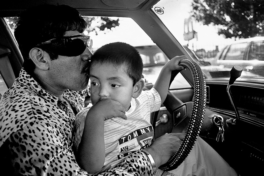 A father and son in a car.