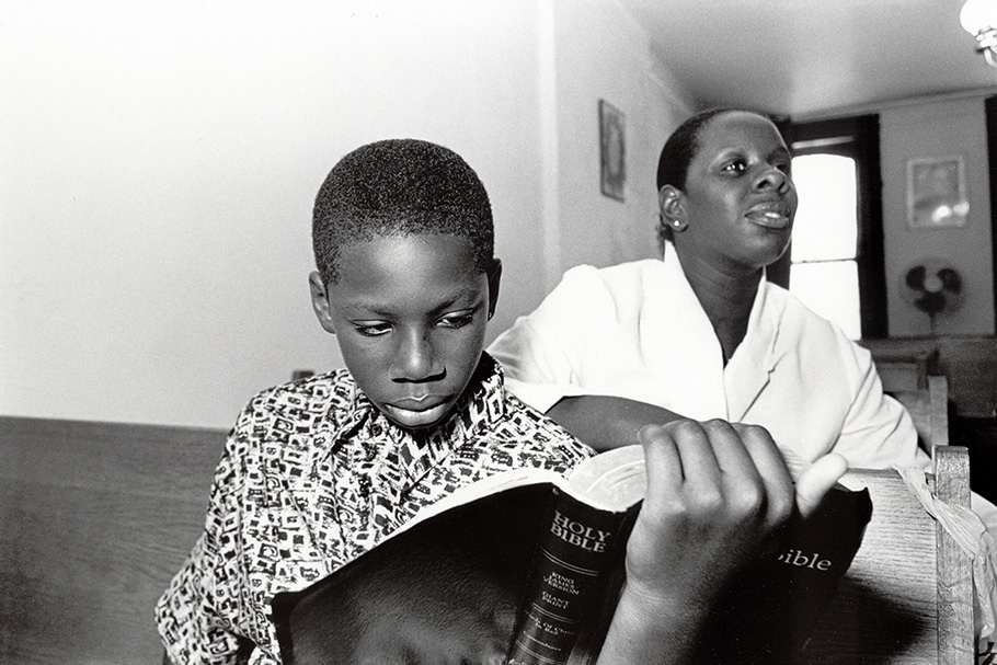 Mother and son reading the Bible. 