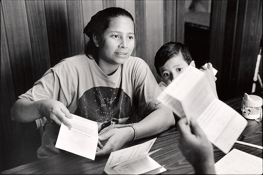 Mother and son with vaccination records.