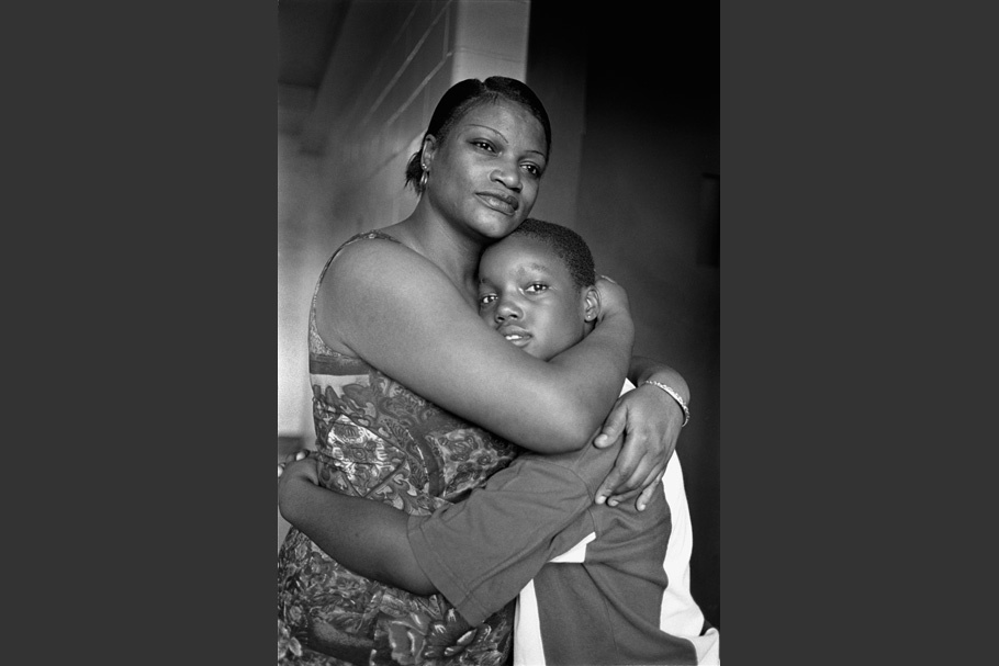 Mother and son embracing.