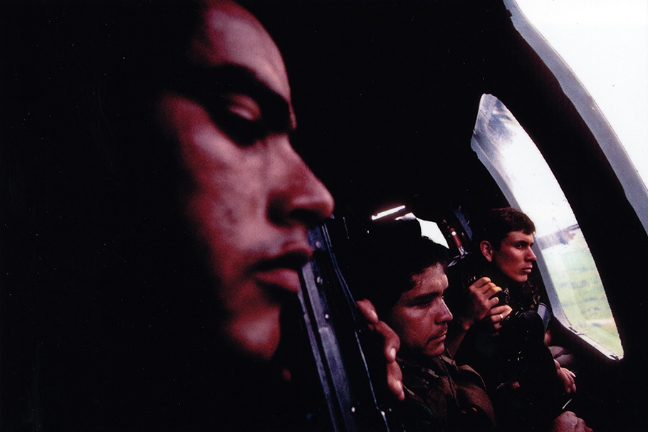 Soldiers in a helicopter.