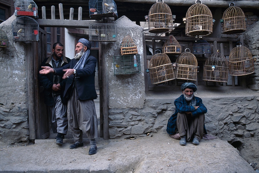 Men selling birdcages.