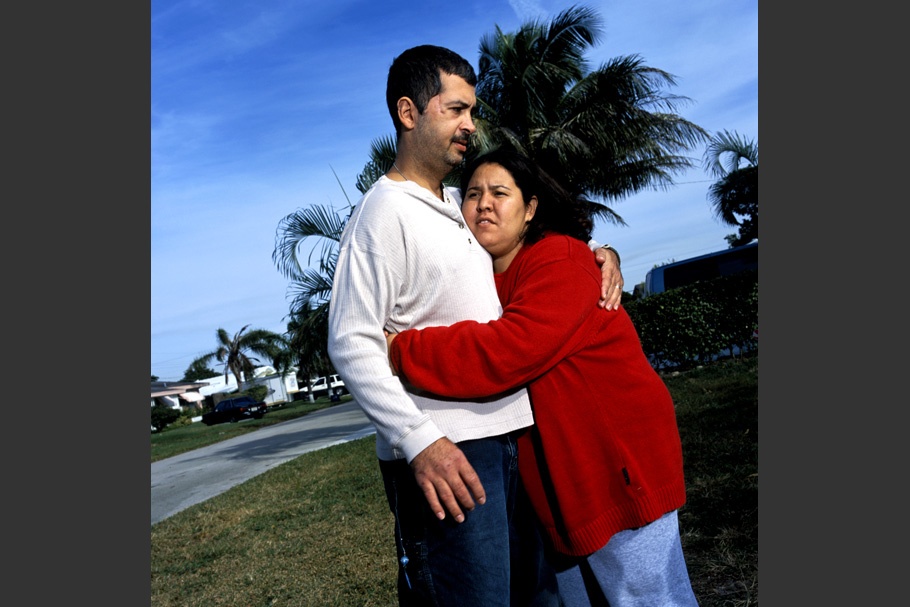 Woman hugging a man.
