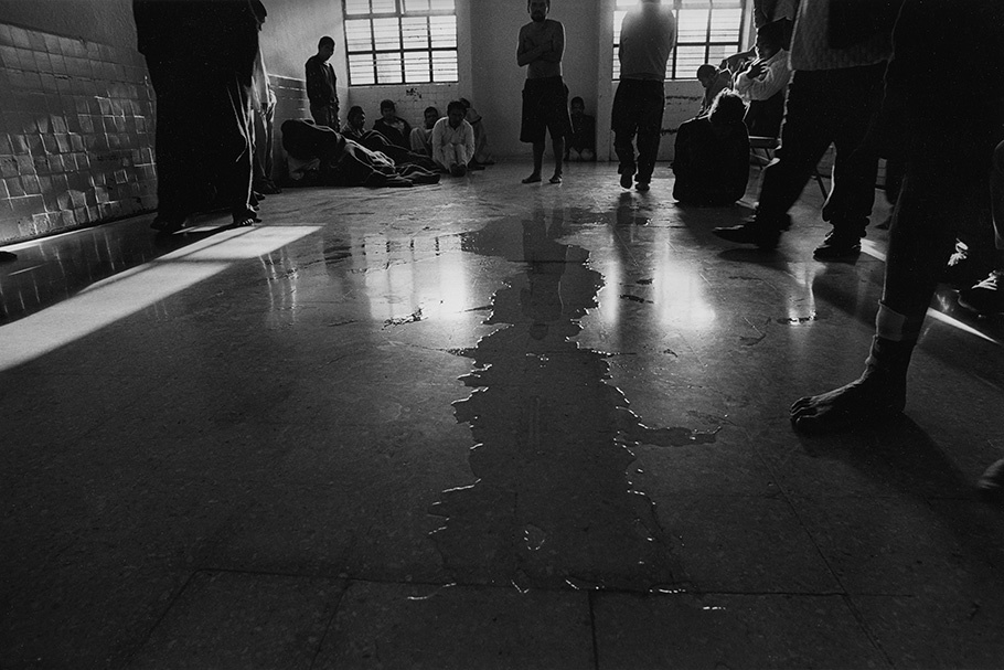 A stream of urine in the middle of a floor.