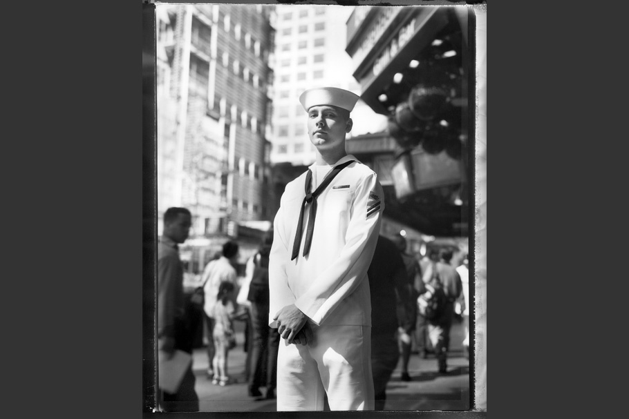 A sailor in uniform.