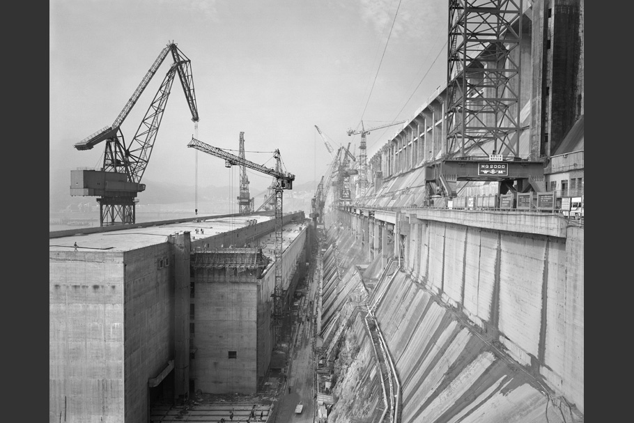 View of damn under construction, with cranes.