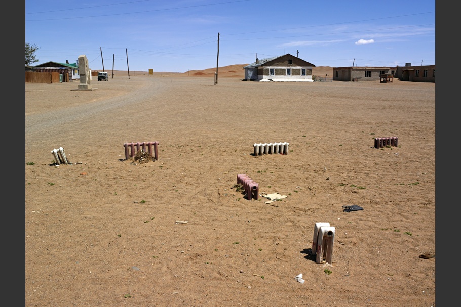 Radiators scattered around a sandy landscape.