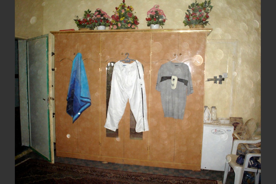 Interior with clothes on hangers.