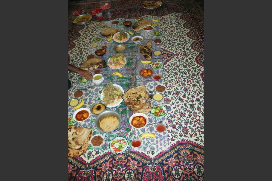 A meal atop a patterned tablecloth.