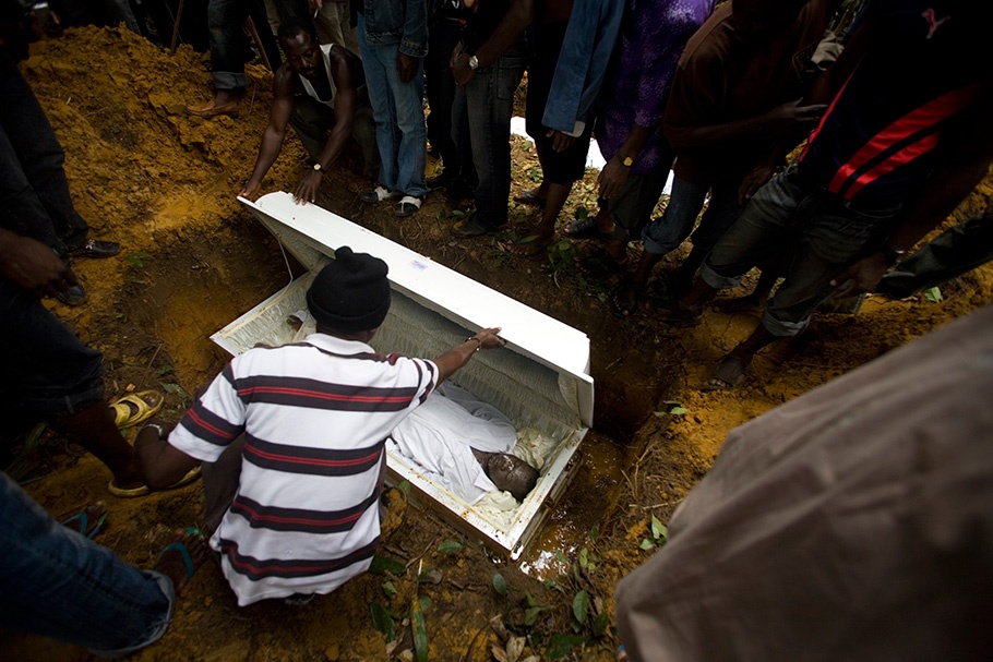 White coffin being buried.