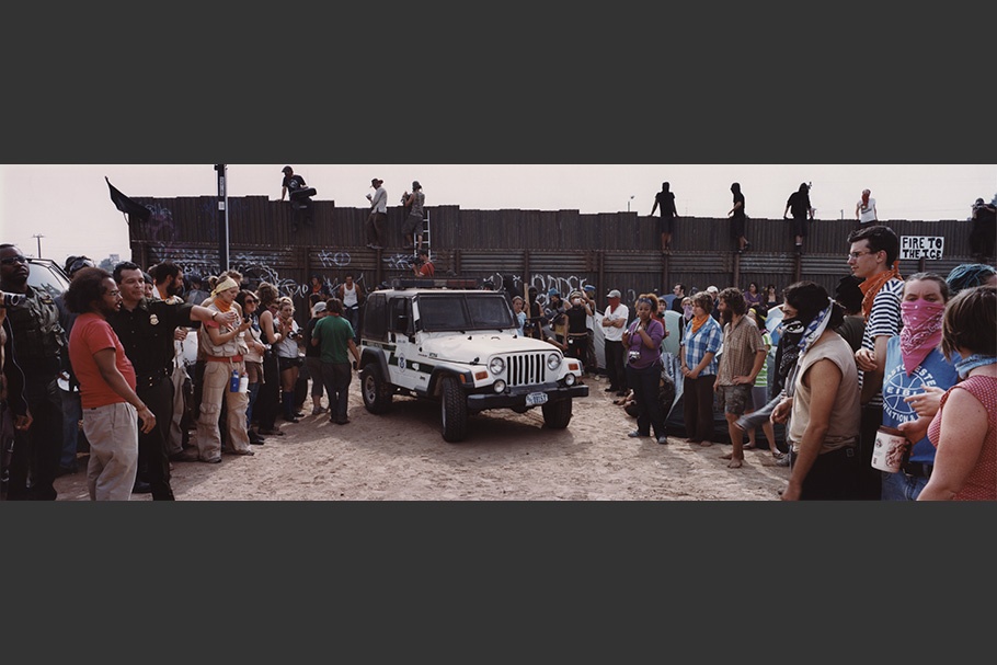 Crowd with white jeep.