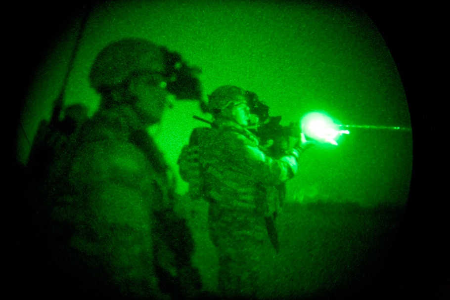 Soldiers firing gun, green.