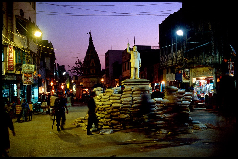 Night street scene with statue.
