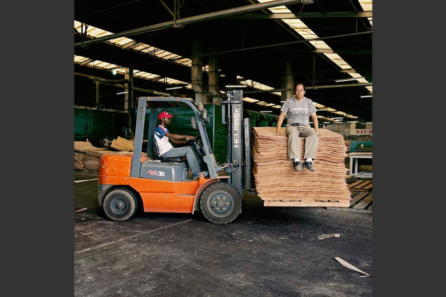 Two men with forklift.