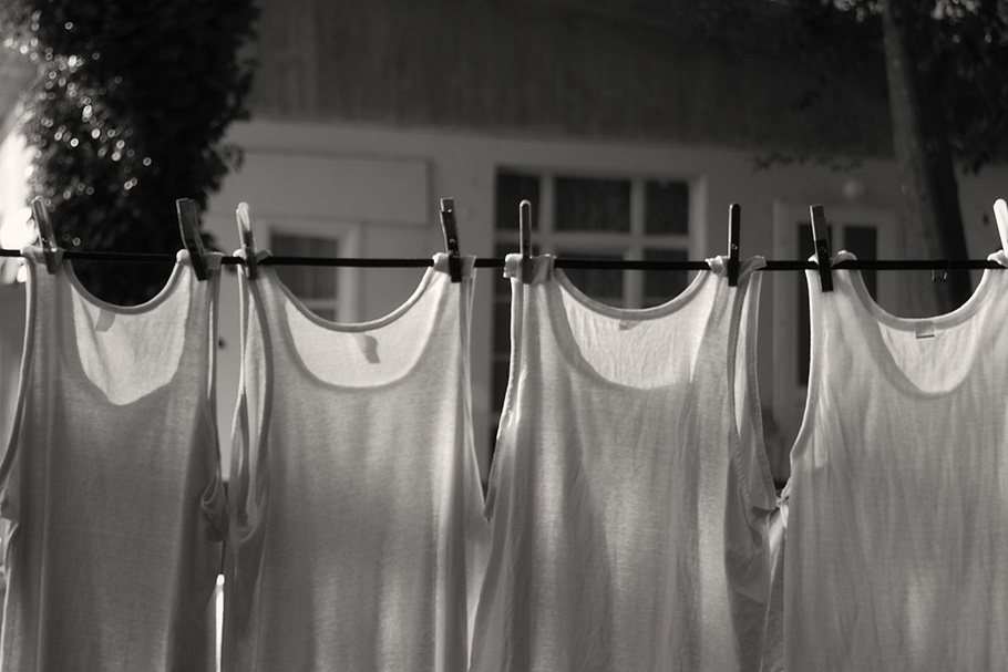 Shirts hanging on laundry line.