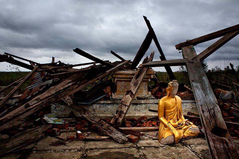 Buddha amidst rubble.