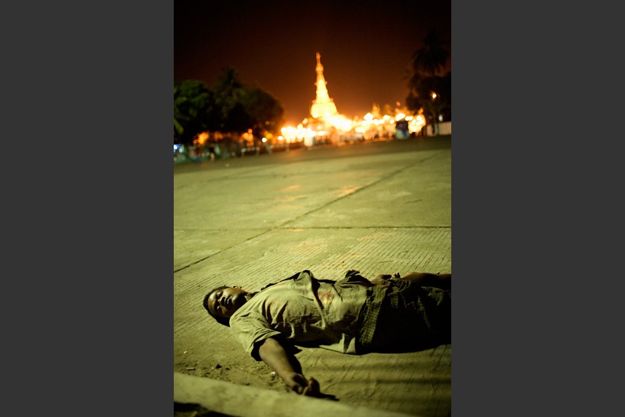 Man lying in street.