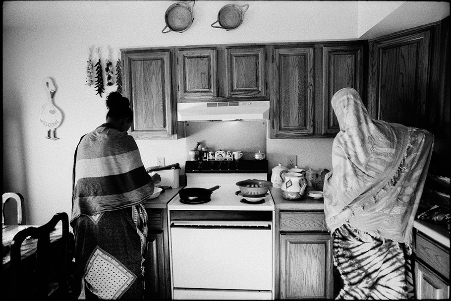 Two women in a kitchen.