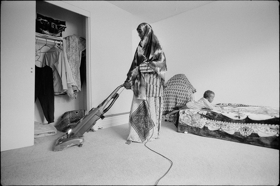 Woman using a vacuum cleaner.