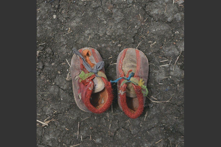 A pair of worn of children shoes