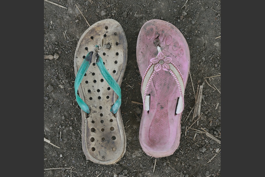 A pair of worn sandals