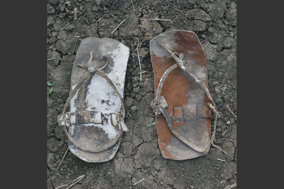 A pair of worn leather sandals