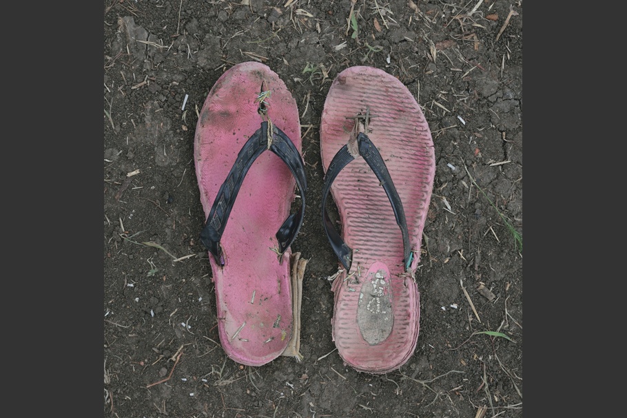 A pair of worn rubber sandals.