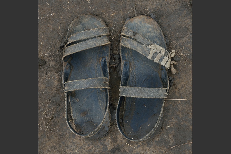 A pair of worn sandals