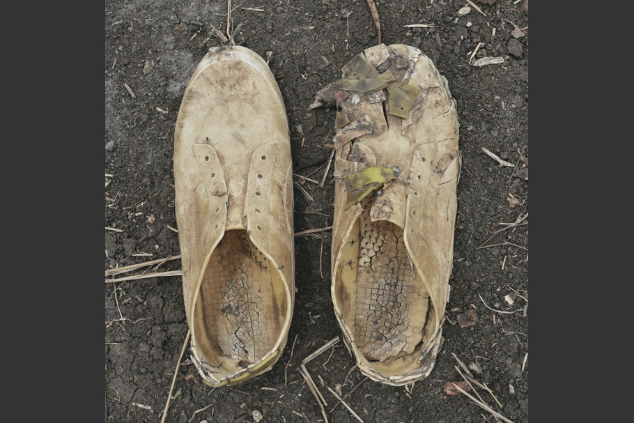 A pair of worn sneakers