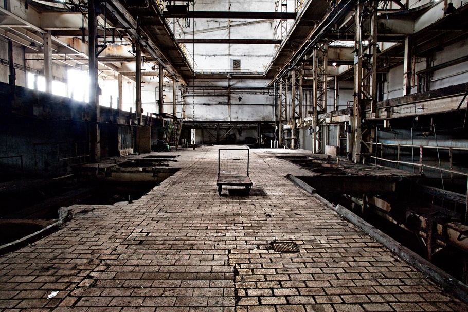 A dolly inside an abandoned factory. 