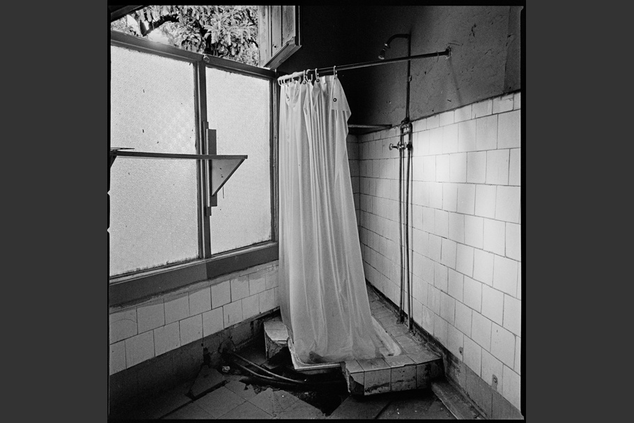 Broken shower in a former detention and torture center