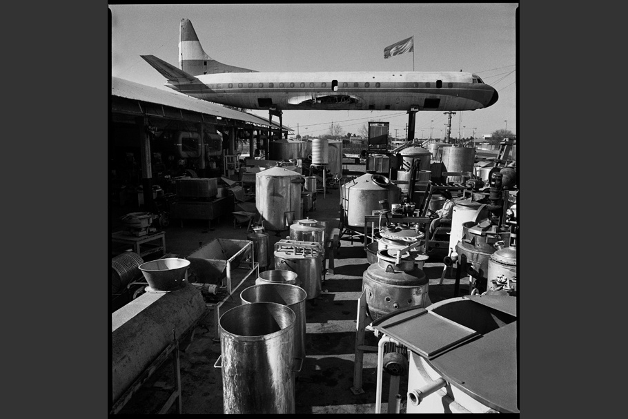 Airplane on display in a lot outside a building supply store