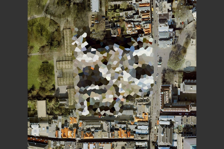 Google Earth image of landscape with colored, irregular-shaped pattern in center