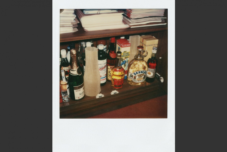 Shelf with bottles of liquor