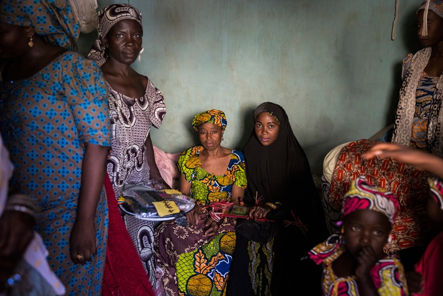 Women sit in a room at a wedding celebration in Kano, Nigeria