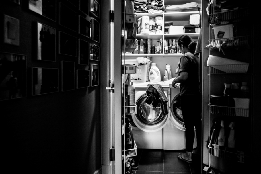 A woman doing laundry.
