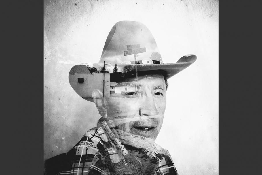 A street superimposed on a man wearing a cowboy hat.