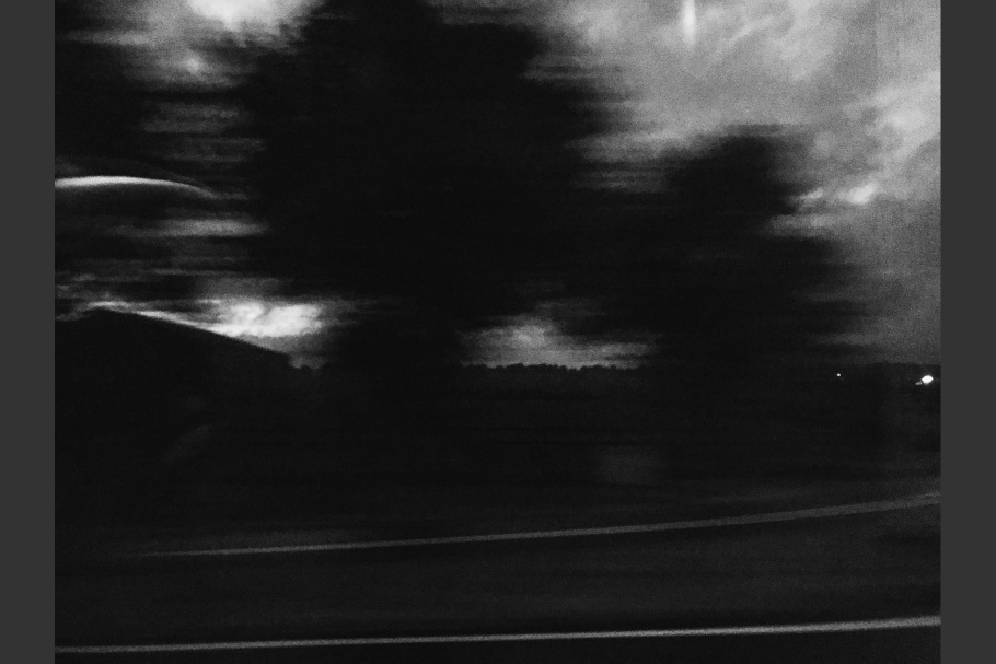 Blurred trees and a road