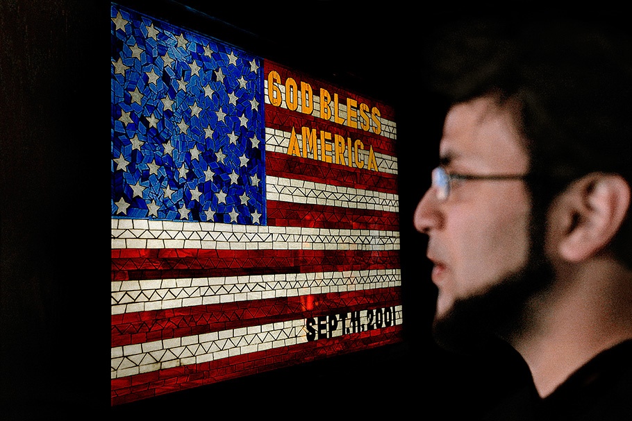 Man in front of an American flag.