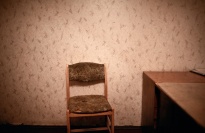 A chair in an empty room.