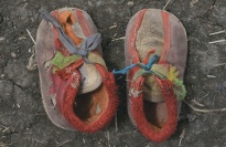 A pair of worn of children shoes